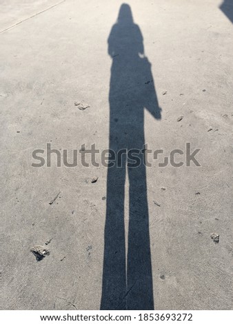 Similar – Shadow of a woman on the beach