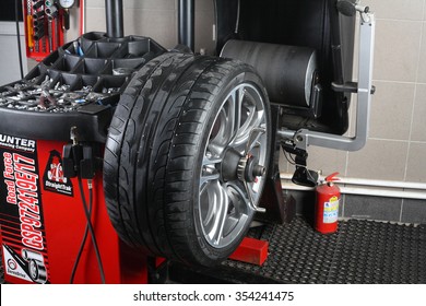 Illustrative Editorial. Balancing Tire Wheel Machine Hunter.  Tyre Assembling. Tire Balance. Car Service 