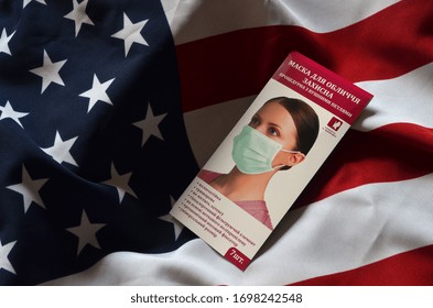 ILLUSTRATIVE EDITORIAL. The countries of the former USSR send humanitarian aid to the countries of the Third World. Concept. Incription - Face mask (UKR )USA Flag background.1April 2020. Kiev,Ukraine