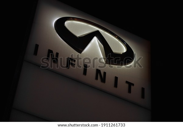 Illustrative Editorial. INFINITY  Company logo on\
the stand at night against a dark sky. Kazakhstan, Almaty -\
September 29, 2020