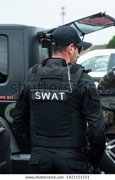 Illzach - France -9 June 2019 -\
portrait of man with swat police uniform at fun car show\
event