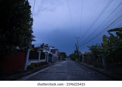 Iloilo City, Philippines - August 10, 2022: Rain Clouds Approaching A Village, Storm And Weather Phenomenon, Darkening The Sky