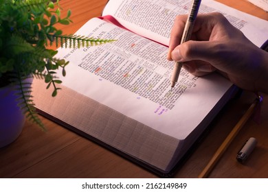 Iloilo City, Philippines - May 30, 2022: An Open Bible With Hand Writing. Concept For Bible Study And Journaling.