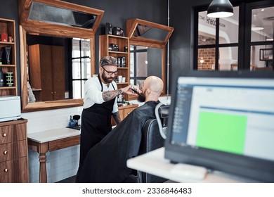 Im the beard expect in this town. Cropped shot of a handsome young barber trimming and lining up a clients beard inside his barbershop. - Powered by Shutterstock