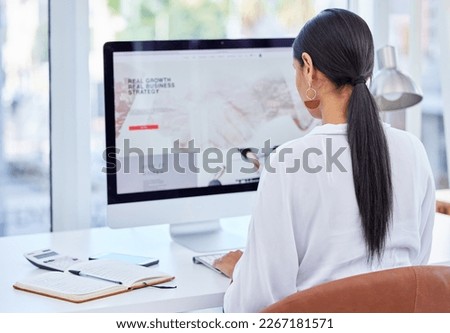 Im coming for everything they said ill never have. Rear view shot of a young businesswoman using her laptop in a modern office.