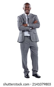 Im Good For Business. Full Length Portrait Of A Businessman Standing With His Arms Folded Against A White Background.