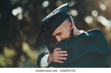 Im Grateful For Everyone Who Supported Me Along The Way. Shot Of Two Students Sharing A Hug On Graduation Day.