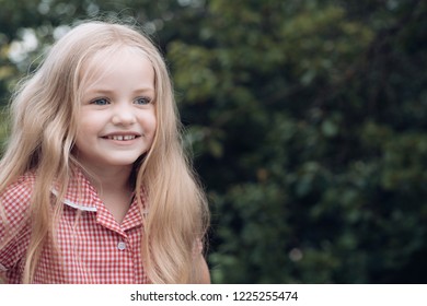 Im Too Happy Being Myself. Small Child Happy Smiling. Little Girl With Blond Hair. Small Girl Wear Long Hair. Happy Little Child With Adorable Smile. Wind Plays In My Hair.