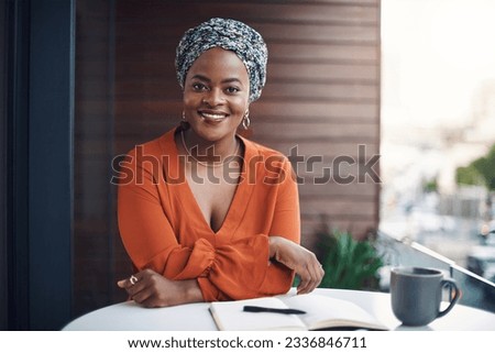 Im here for success. Cropped portrait of an attractive businesswoman working at a desk in her office.
