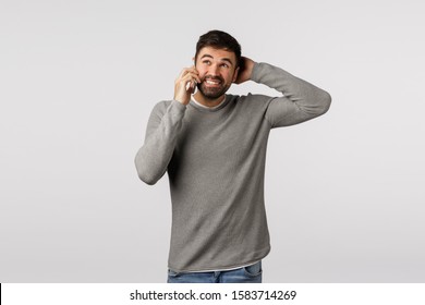Im not sure. Clueless, indecisive young man trying avoid responsibility, skipping work, make excuses, scratch head as talking phone, look away thoughtful, standing puzzled, hold smartphone near ear - Shutterstock ID 1583714269