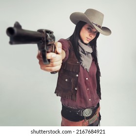Im The Sheriff Around These Parts.... Full-length Shot Of An Attractive Young Woman In Cowboy Attire.