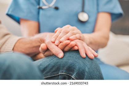 Im thankful for your comfort. Shot of a nurse offering her elderly male patient support.