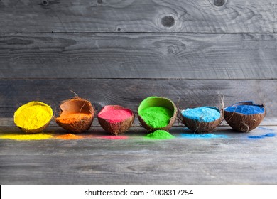 Bright colours in coconut shells for Indian holi festival. Colorful gulal (powder colors) for Happy Holi.