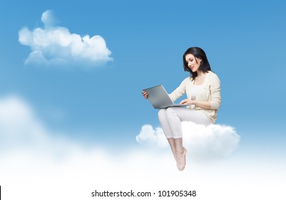 Girl working on computer in sky
