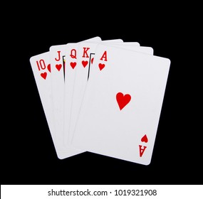 Speelkaarten 10,J,Q,K,A geïsoleerd op een zwarte achtergrond.