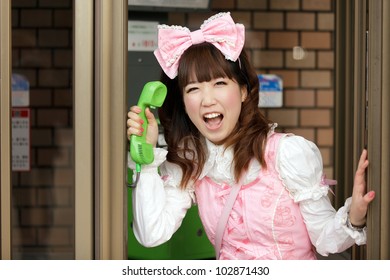 japanese lolita cosplay shouting in public phone