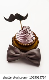 Happy father's day special cupcake and bow tie on a white background