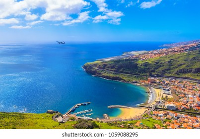 Beach aerials view of Machico bay and Cristiano Ronaldo International airport in Madeira, Portugal
