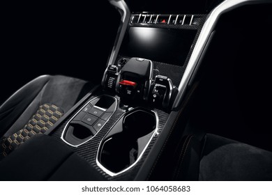 Supercar carbon dashboard interior in dark with start and stop button and glass holder lamborghini hypercar style