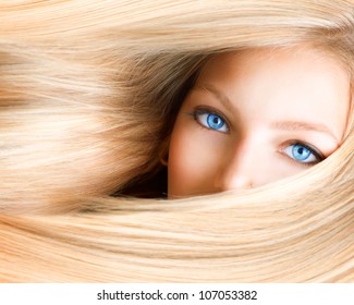 Blond Girl. Blonde Woman with Blue Eyes. Healthy Long Blond Hair. Hair Extension