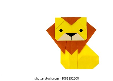 Origami for kids : big lion with folded paper on white background isolated. Copy space for text.Top view, flat lay. Easy to use for card.