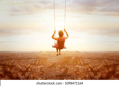 happiness and freedom concept, happy romantic beautiful young girl on the swing above the city landscape, cityscape at sunset, dream, joy and inspiration, inspiring life 