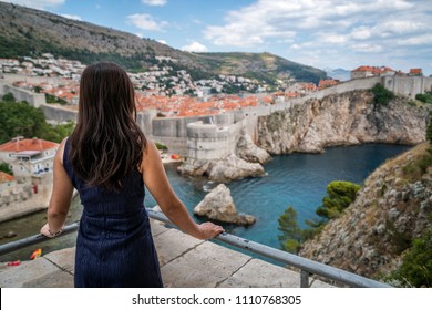 Woman traveller at Dubrovnik Old Town, in Dalmatia, Croatia - The prominent travel destination of Croatia, Dubrovnik old town was Game of Thrones shooting location.