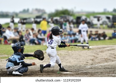 A girl playing Japanese baseball
