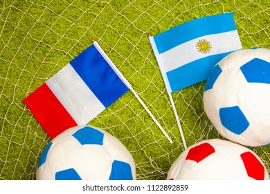 Football match between Argentina and France. Flag of Argentina on the football field. Flag of France with football swords. Football game. Team of Argentina against the team of France.