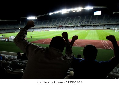 Stadium with fans silhouettes