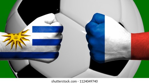 Flags of Uruguay and France painted on two clenched fists facing each other with closeup 3d soccer ball in the background/Mixed media football match concept