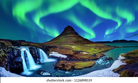 Northern Light, Aurora borealis at Kirkjufell in Iceland. Kirkjufell mountains in winter.
