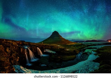 Northern Light, Aurora borealis at Kirkjufell in Iceland. Kirkjufell mountains in winter.