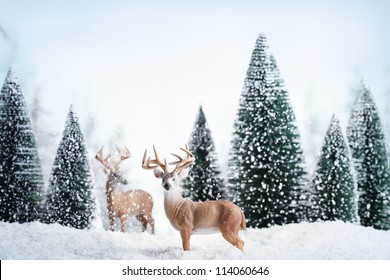 Winter landscape with deers,snow and fir tree.