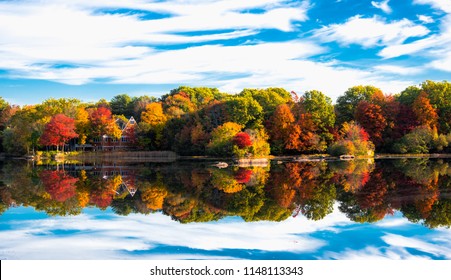 house on a lake in autumn