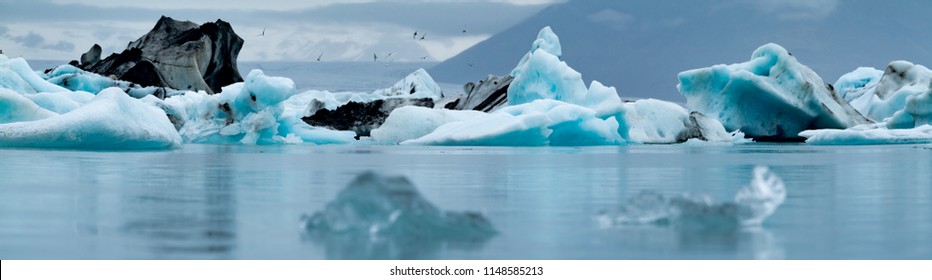 Icebergs floating near the Vatnajökull Glacier in Southern Iceland. These icebergs broke/calved off the glacier and are on their way out into the arctic sea.