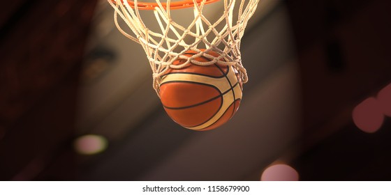 Bola basket oranye terbang melalui keranjang