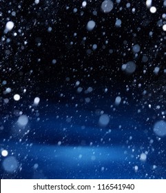雪のクリスマスの魔法のライトの背景