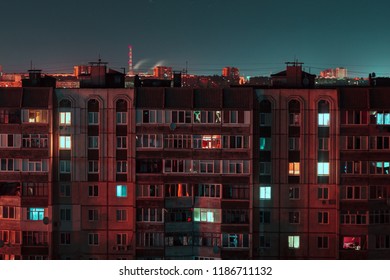 Night long exposure photo 9 and 10 floors high-rise buildings in red and blue colours. Big city life is here!