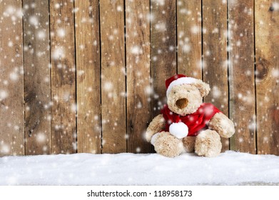 teddy bear sitting in the snow