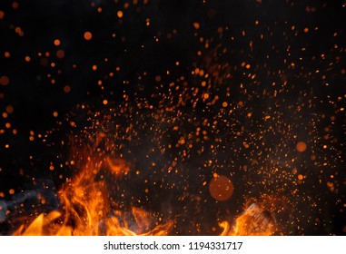 Fire sparks particles with flames isolated on black background. Very high resolution