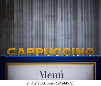 A Sign For Cappuccino At An Urban Coffee Shop With Copy Space