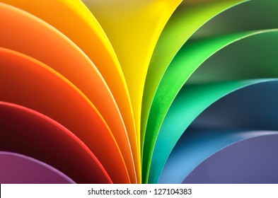 Abstract rainbow background with colored paper.Dark tones.