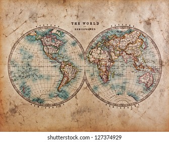 Een echte oude gekleurde wereldkaart dateert uit het midden van de 19e eeuw en toont het westelijk en oostelijk halfrond met handkleuring.