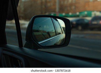 Car rear view mirror rear view highway evening light