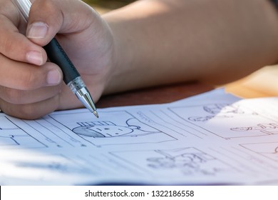 Pre-production for film movie story concept : Hands drawing storyboard animation comic carton, design creative scene layout at studio. Behind making work before production films or video shot