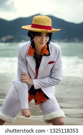 Cosplay of boy girl with straw hat on beach near ocean sea want to fight