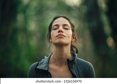 Young beautiful woman exercise in the forest