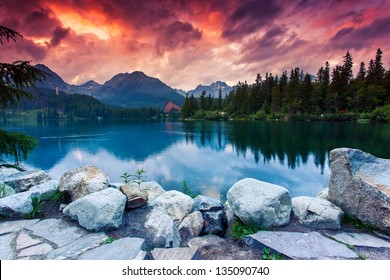 Mountain lake in National Park High Tatra. Dramatic overcrast sky. Strbske pleso, Slovakia, Europe. Beauty world.