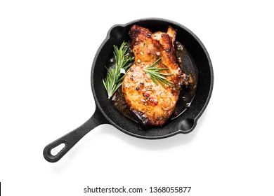 Fried pork steak in frying pan  isolated on white background. 